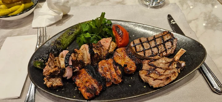 Divan Brasserie Bebek signature dishes Grilled Sea Bass, Divan Meatballs, Schnitzel, Profiterole